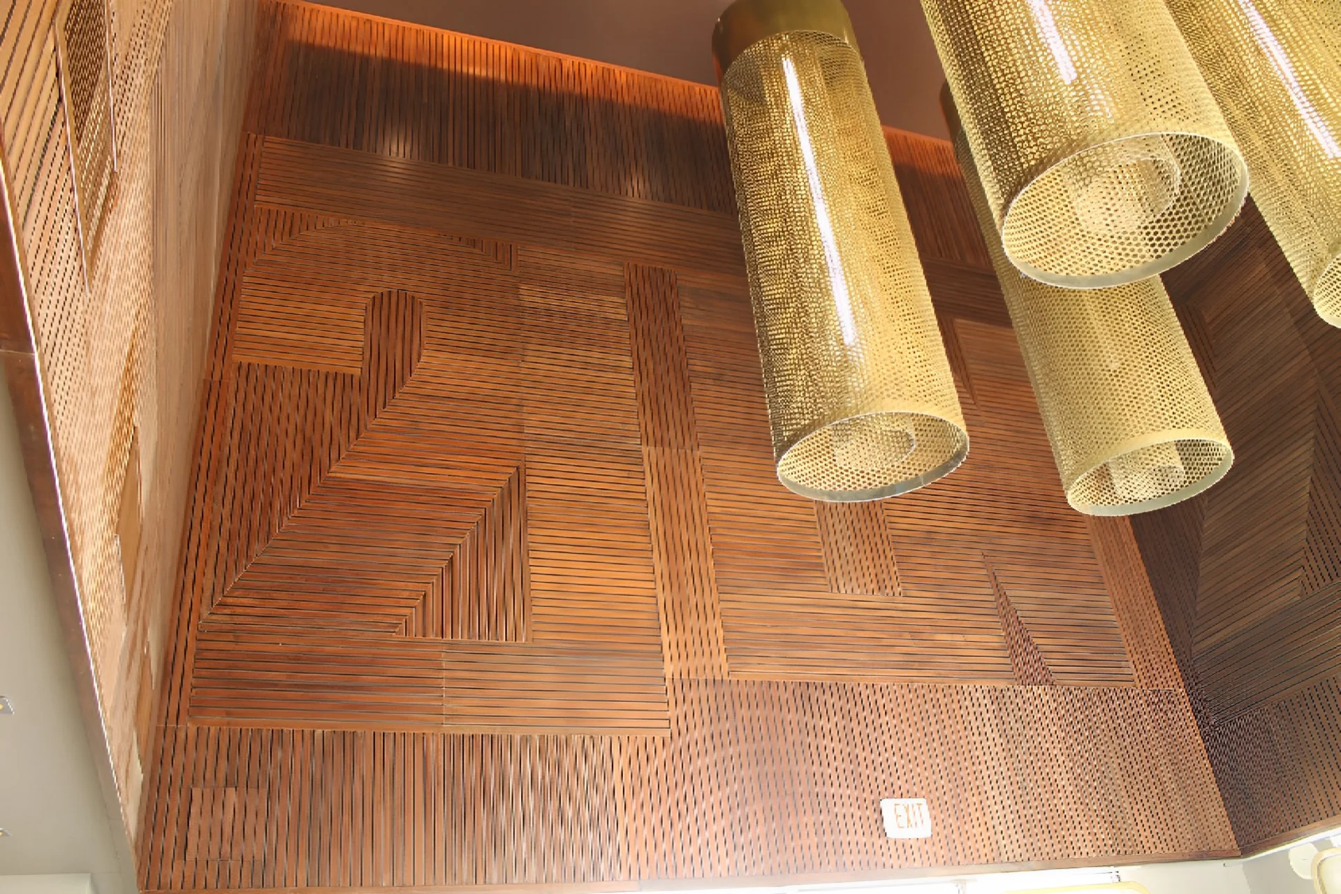 A floor with some wood floors and two large tubes