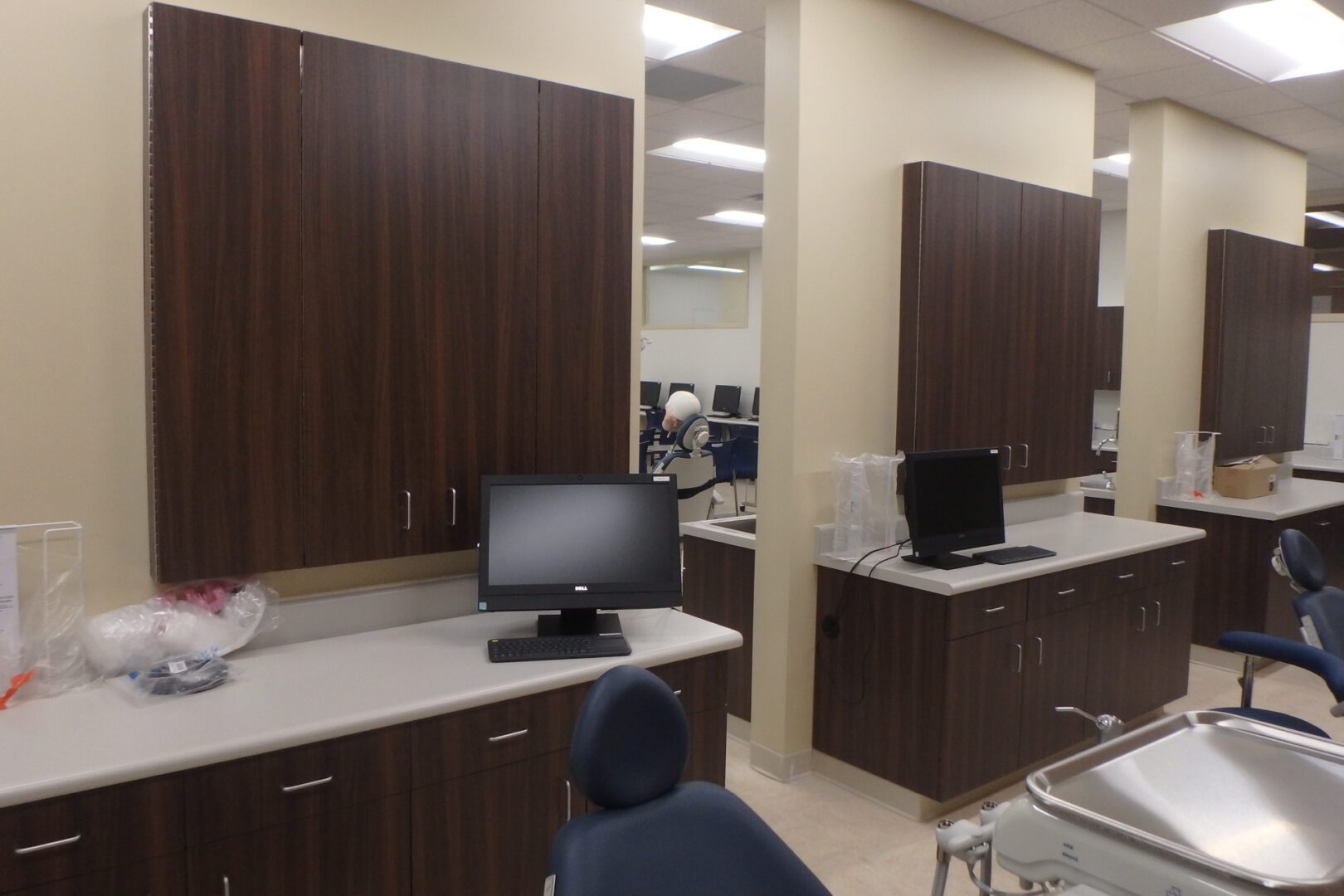 A dentist office with a computer and other equipment.