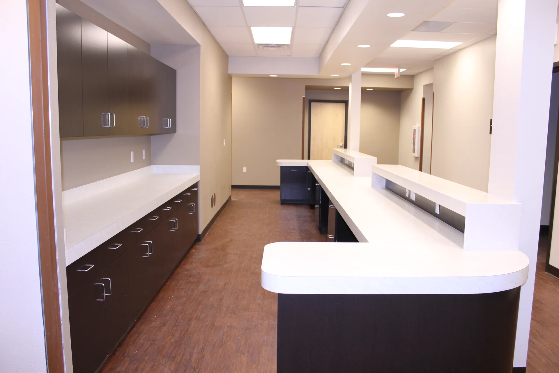 A large room with many counters and cabinets.