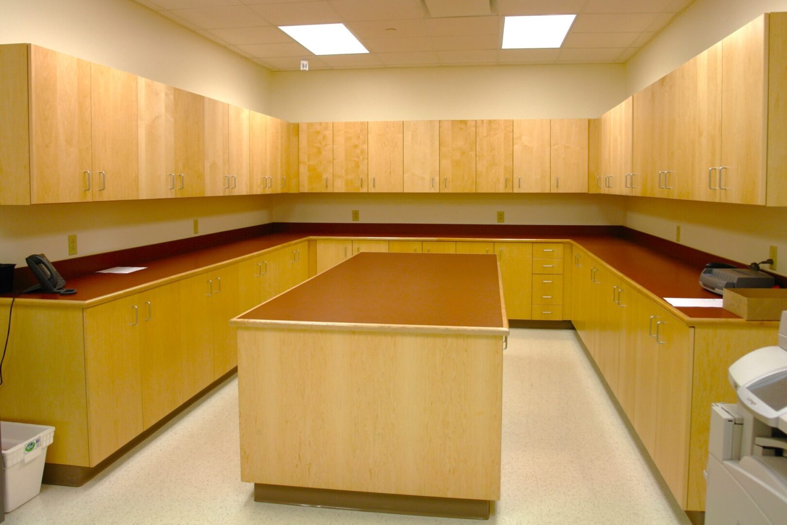 A large wooden table in the middle of a room.