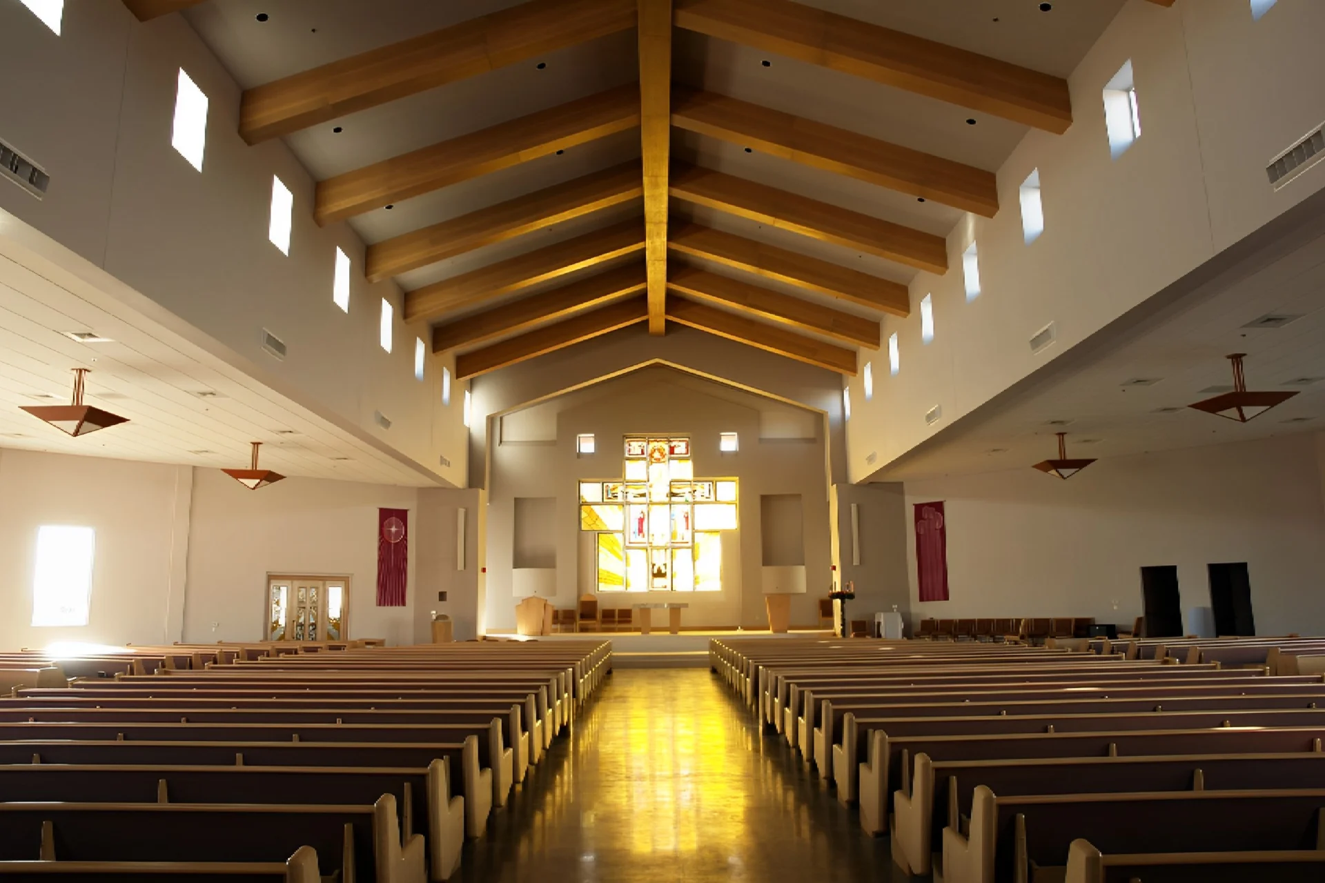 A church with many pews and a large window