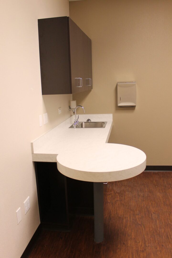 A bathroom with a sink and counter top